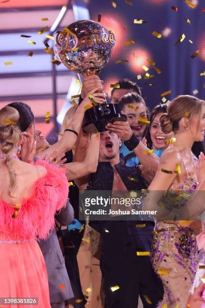 Kathrin Menzinger and Rene Casselly celebrate winning the final show of the 15th season of the television competition show "Let's Dance" at MMC...