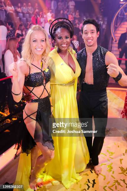 Kathrin Menzinger and Rene Casselly celebrate with Motsi Mabuse after winning the final show of the 15th season of the television competition show...