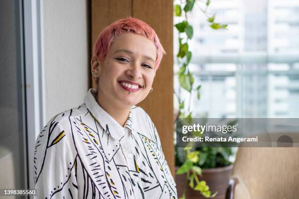 portrait of a non-binary person with dye hair - dyed hair stock pictures, royalty-free photos & images
