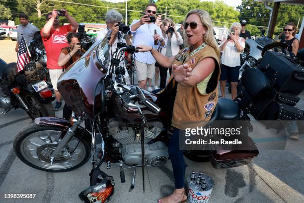 Rep. Marjorie Taylor Greene sits on a motorcycle at a Bikers for Trump campaign event held at the Crazy Acres Bar & Grill on May 20, 2022 in...