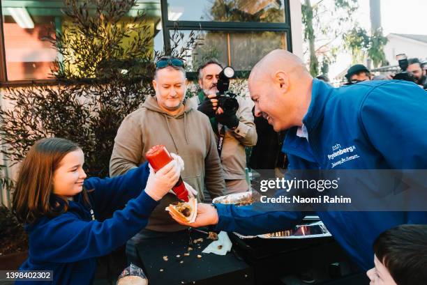 Josh Frydenberg, Treasurer of Australia visits the sausage sizzle after voting on May 21, 2022 in Melbourne, Australia. Australians head to the polls...