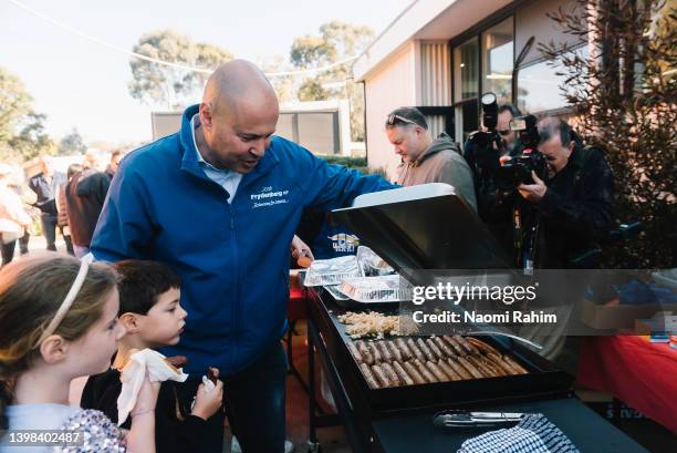 Josh Frydenberg, Treasurer of Australia visits the sausage sizzle after voting on May 21, 2022 in Melbourne, Australia. Australians head to the polls...