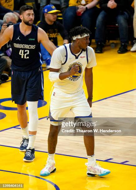 Kevon Looney of the Golden State Warriors reacts after drawing a foul against Maxi Kleber of the Dallas Mavericks during the third quarter in Game...