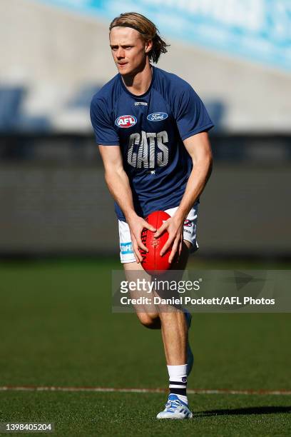 Zach Guthrie of the Cats warms up before the round 10 AFL match between the Geelong Cats and the Port Adelaide Power at GMHBA Stadium on May 21, 2022...