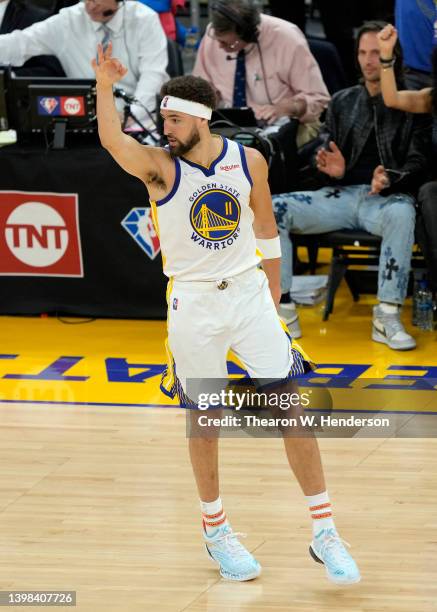 Klay Thompson of the Golden State Warriors celebrates a three point basket during the fourth quarter against the Dallas Mavericks in Game Two of the...