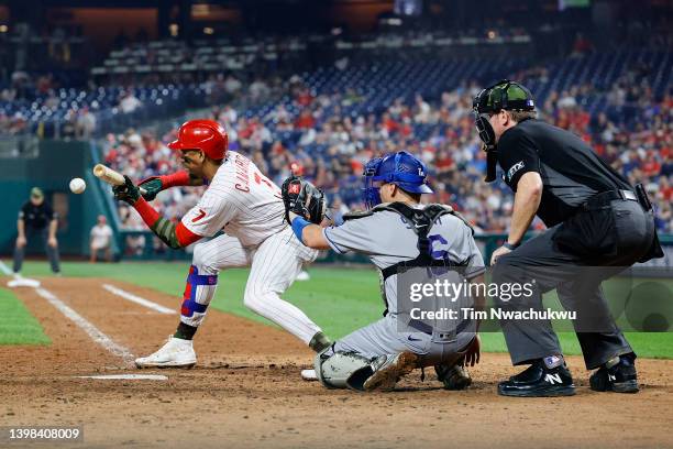 Johan Camargo of the Philadelphia Phillies bunts during the eighth inning against the Los Angeles Dodgers at Citizens Bank Park on May 20, 2022 in...