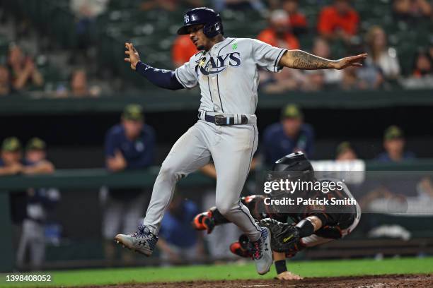 Catcher Anthony Bemboom of the Baltimore Orioles tags out Wander Franco of the Tampa Bay Rays during the thirteenth inning at Oriole Park at Camden...