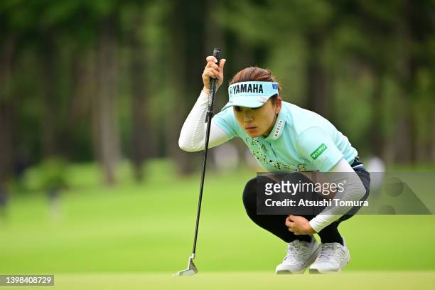 Chie Arimura of Japan lines up a putt on the 4th green during the third round of Bridgestone Ladies Open at Sodegaura Country Club Sodegaura Course...