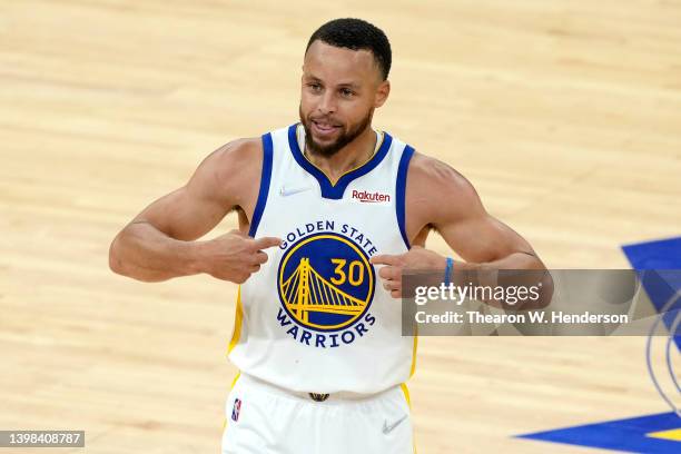 Stephen Curry of the Golden State Warriors reacts after a play during the fourth quarter against the Dallas Mavericks in Game Two of the 2022 NBA...