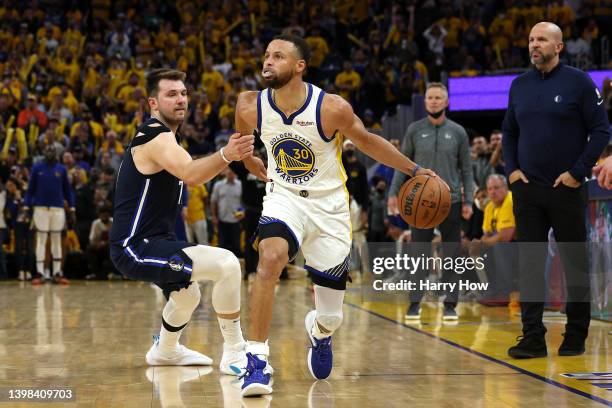 Stephen Curry of the Golden State Warriors drives past Luka Doncic of the Dallas Mavericks during the fourth quarter in Game Two of the 2022 NBA...