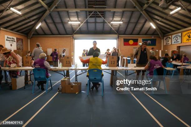 People arrive to cast their votes at a polling center during the 2022 federal election on May 21, 2022 in Geraldton, Australia. Australians head to...