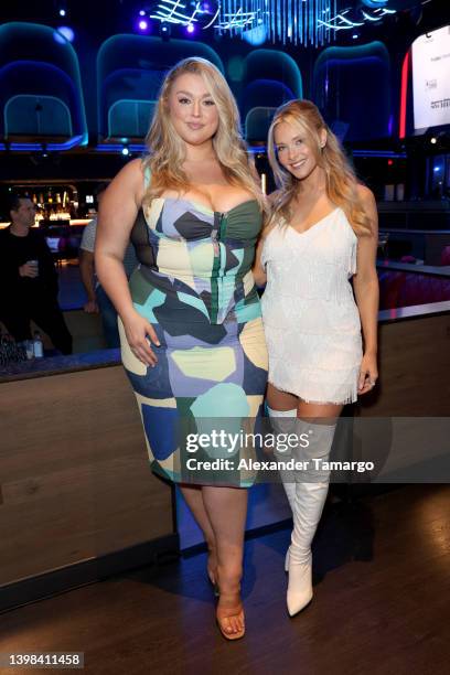 Hunter McGrady and Camille Kostek attend as Sports Illustrated Swimsuit celebrates the launch of the 2022 issue and debut of Pay With Change at...