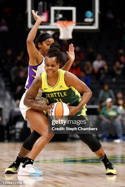 Lexie Brown of the Los Angeles Sparks defends Epiphanny Prince of the Seattle Storm during the second half at Climate Pledge Arena on May 20, 2022 in...