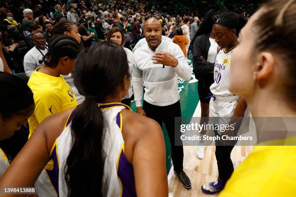 Head coach Derek Fisher of the Los Angeles Sparks gathers his players before the game against the Seattle Storm at Climate Pledge Arena on May 20,...