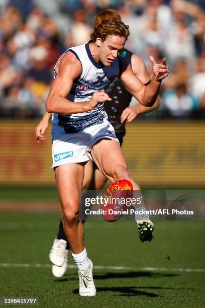 Cooper Stephens of the Cats kicks the ball during the round 10 AFL match between the Geelong Cats and the Port Adelaide Power at GMHBA Stadium on May...