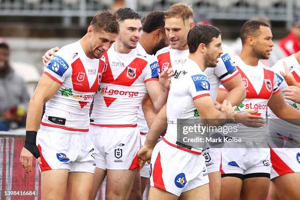 Zac Lomax of the Dragons celebrates with his team mates after scoring a try during the round 11 NRL match between the St George Illawarra Dragons and...