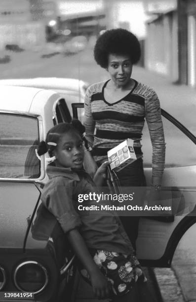 Laura Marie and her mother Cynthia Robinson of the psychedelic soul group 'Sly And The Family Stone' stand next to a car on April 3, 1973 in San...