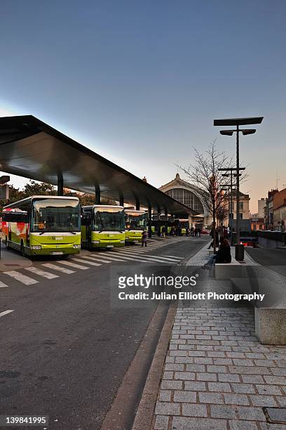 the main bus and coach station in tours, france. it is situated directly in front of the train station, which can just be seen in the background. - coach bus photos et images de collection