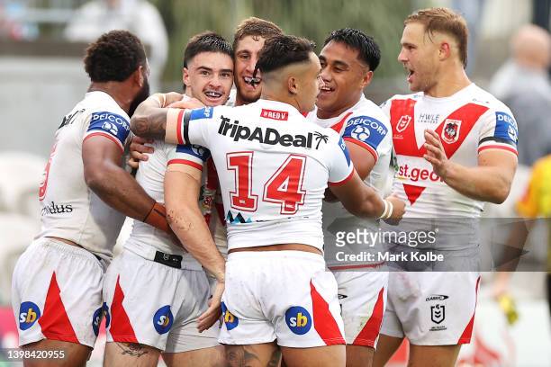 Cody Ramsey of the Dragons celebrates with his team mates after scoring a try during the round 11 NRL match between the St George Illawarra Dragons...