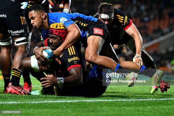 Toni Pulu of the Force tackles Pita Gus Sowakula of the Chiefs during the round 14 Super Rugby Pacific match between the Chiefs and the Western Force...