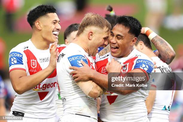 Jack De Belin of the Dragons congratulates Michael Molo of the Dragons as he celebrates with his team mates after scoring a try during the round 11...