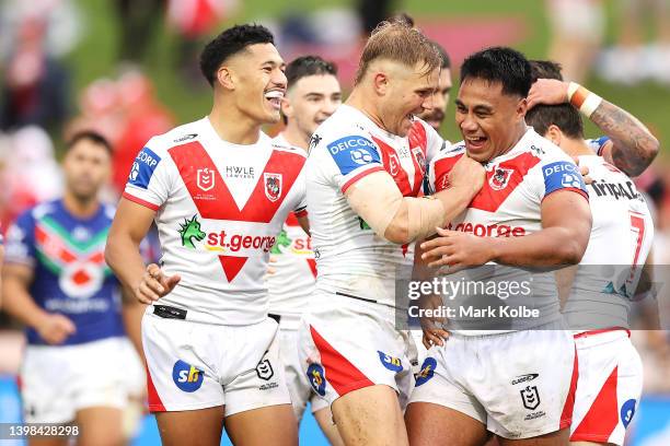 Jack De Belin of the Dragons congratulates Michael Molo of the Dragons as he celebrates with his team mates after scoring a try during the round 11...