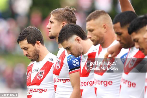 Ben Hunt of the Dragons stands with his team during a pre-match ceremony in memory of St George legend John Raper before play in the round 11 NRL...