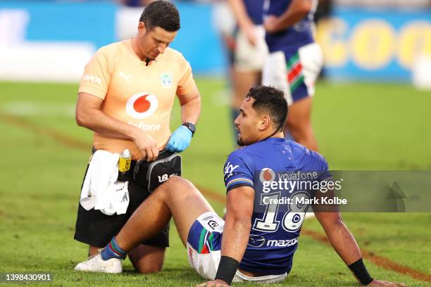 Eliesa Katoa of the Warriors receives attention from the trainer during the round 11 NRL match between the St George Illawarra Dragons and the New...