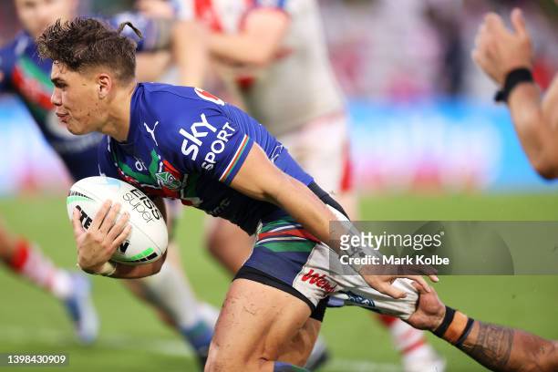 Reece Walsh of the Warriors is tackled during the round 11 NRL match between the St George Illawarra Dragons and the New Zealand Warriors at...
