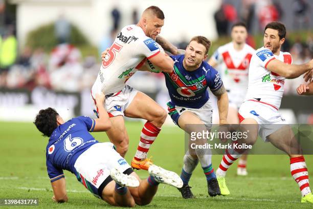 Tariq Sims of the Dragons is tackled during the round 11 NRL match between the St George Illawarra Dragons and the New Zealand Warriors at Netstrata...
