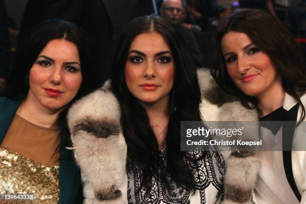 Amina Huck and her sisters Munerva and Muamera watch the WBA World Championship Heavyweight fight between Marco Huck of Germany and Alexander...
