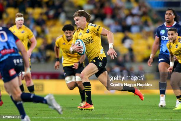 Jordie Barrett of the Hurricanes makes a break during the round 14 Super Rugby Pacific match between the Hurricanes and the Melbourne Rebels at Sky...