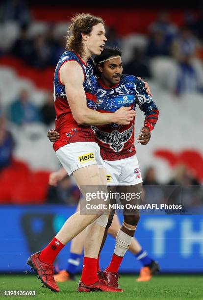 Kysaiah Pickett of the Demons celebrates with teammate Ben Brown after kicking a goal during the round 10 AFL match between the North Melbourne...