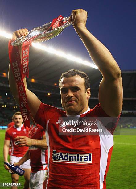 Jamie Roberts of Wales lifts the Triple Crown trophy after the RBS 6 Nations match between England and Wales at Twickenham Stadium on February 25,...