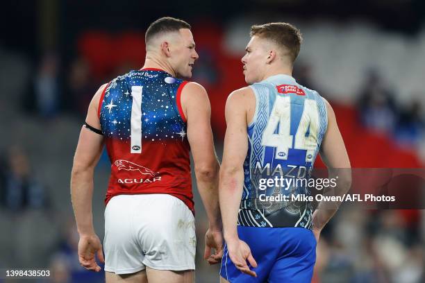 Steven May of the Demons and Cameron Zurhaar of the Kangaroos exchange words with each other after a tussle during the round 10 AFL match between the...