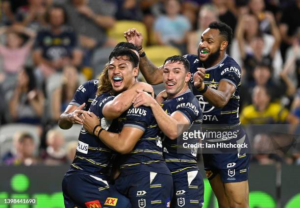Jeremiah Nanai of the Cowboys celebrates after scoring a try during the round 11 NRL match between the North Queensland Cowboys and the Melbourne...