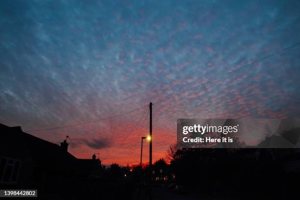 sunset with a burning sky - solar street light stock pictures, royalty-free photos & images