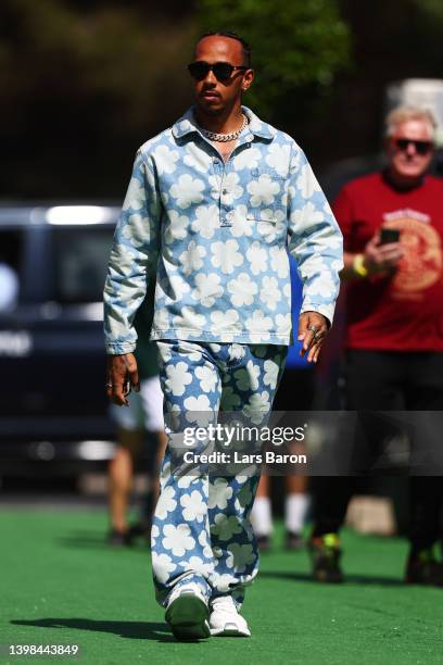 Lewis Hamilton of Great Britain and Mercedes walks in the Paddock prior to practice ahead of the F1 Grand Prix of Spain at Circuit de...