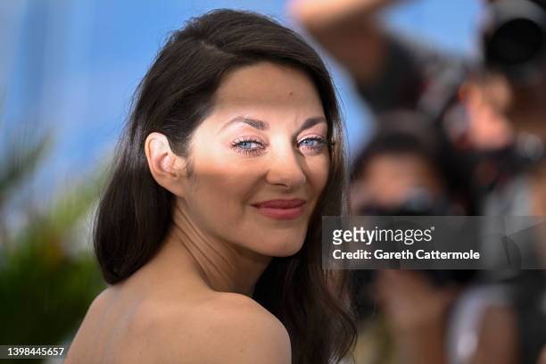Marion Cotillard attends the photocall for "Brother And Sister " during the 75th annual Cannes film festival at Palais des Festivals on May 21, 2022...