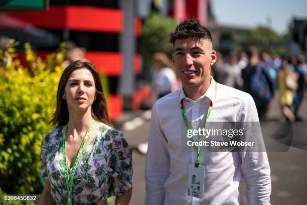 MotoGP rider Aleix Espargaro of Spain and Aprilia Racing walks through the F1 Paddock with his wife Laura Montero during practice/qualifying ahead of...