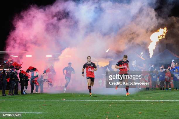 Braydon Ennor and Jack Goodhue of the Crusaders run out prior to the round 14 Super Rugby Pacific match between the Crusaders and the Fijian Drua at...
