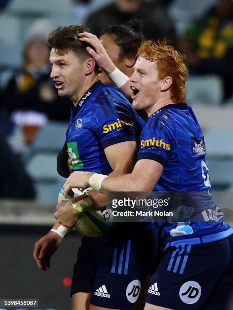 Beauden Barrett of the Blues celebrates a try during the round 14 Super Rugby Pacific match between the ACT Brumbies and the Blues at GIO Stadium on...