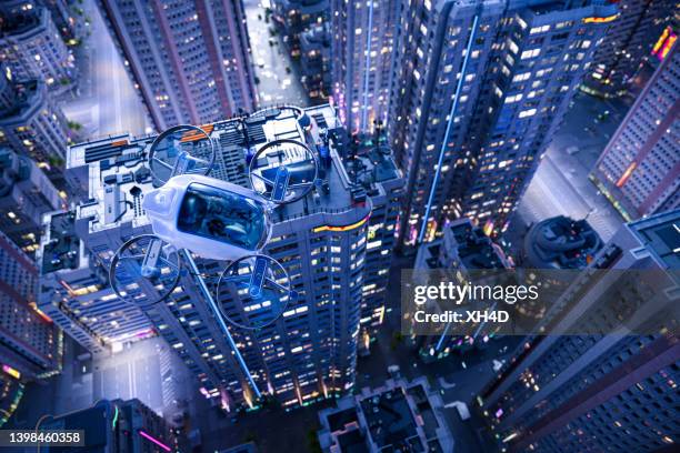 le transport urbain du futur avec evtol - hélicoptère ville photos et images de collection