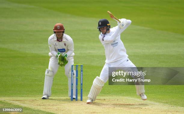 Aneurin Donald of Hampshire plays a shot as Steve Davies of Somerset keeps during Day Three of the LV= Insurance County Championship match between...