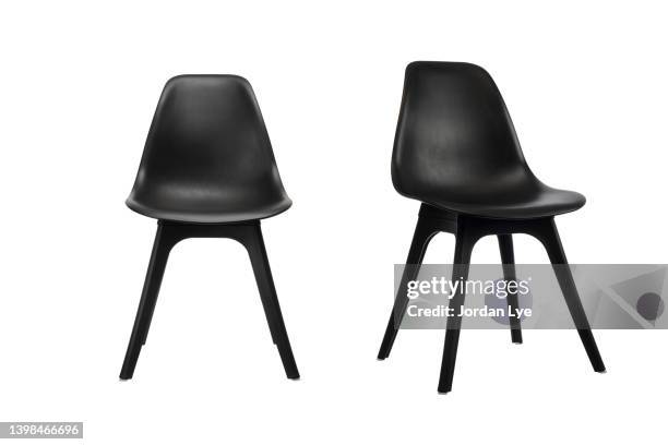 black office stacking chair on white background - chair stock pictures, royalty-free photos & images