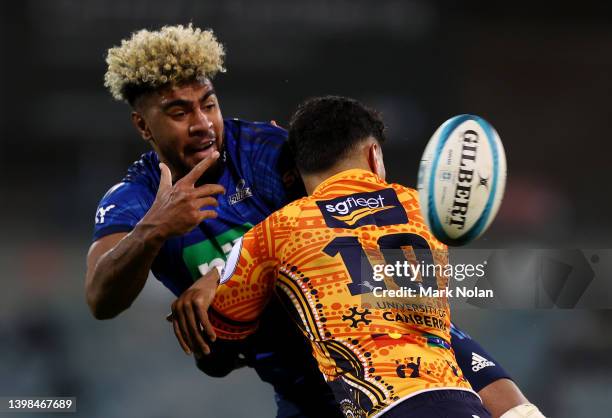 Hoskins Sotutu of the Blues offloads during the round 14 Super Rugby Pacific match between the ACT Brumbies and the Blues at GIO Stadium on May 21,...