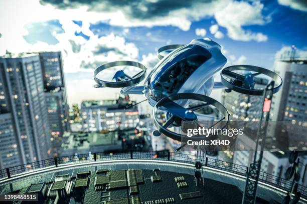 evtol ready to land on the roof tarmac - captain planet 個照片及圖片檔