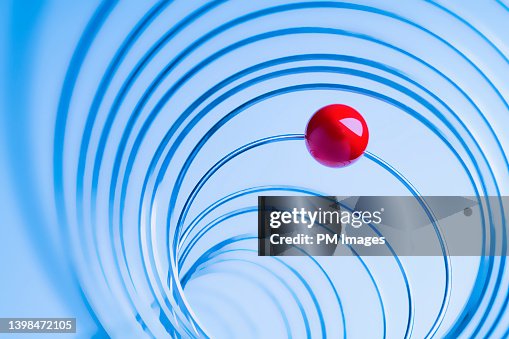 Red Ball Riding Metal Wire High-Res Stock Photo - Getty Images