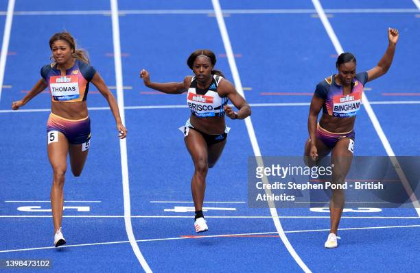 Gabrielle Thomas of United States crosses the finish line first alongside Mikiah Brisco of United States and Khamica Bingham of Canada in the Women's...