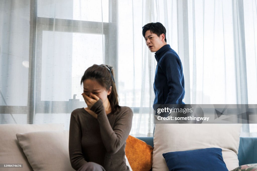 Handsome man and beautiful young woman are having quarrel.